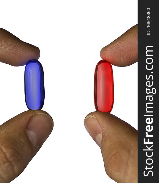 Closeup of fingers holding  blue and red pills against white background. Closeup of fingers holding  blue and red pills against white background
