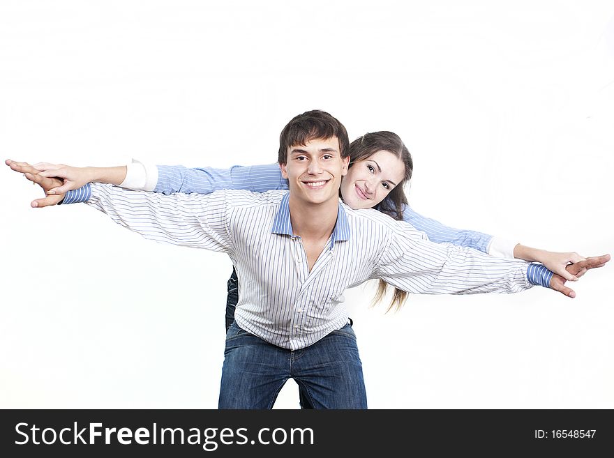 Two young happy person with the hands lifted upwards. Two young happy person with the hands lifted upwards