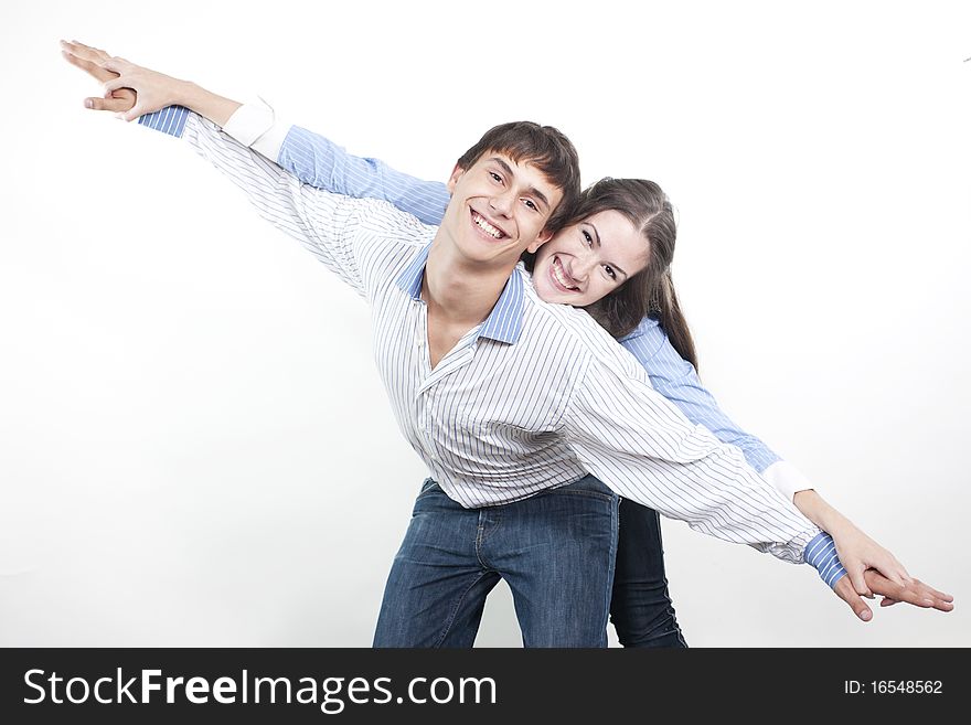 Two young happy person with the hands lifted upwards. Two young happy person with the hands lifted upwards