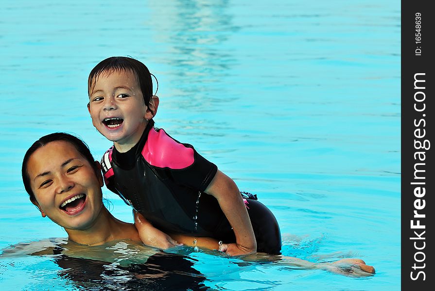 Mum and Son in Pool