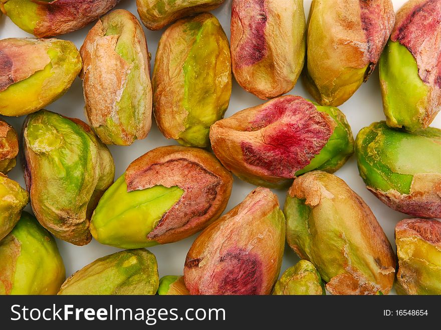 Background of salted green pistachio nuts. Background of salted green pistachio nuts