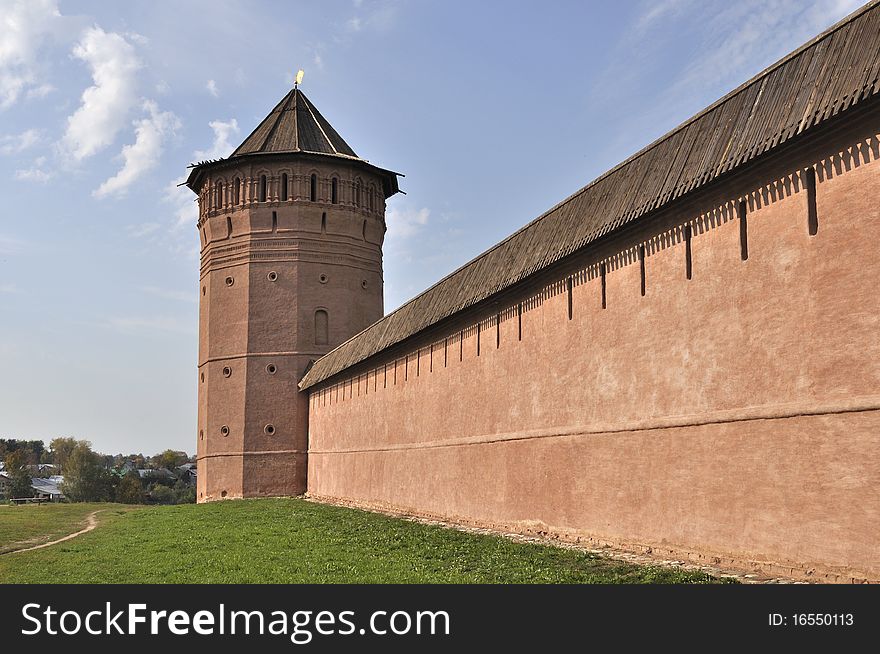 Tower and wall of old russian monastery in Suzdal