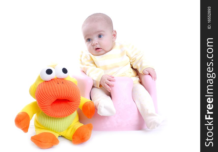 Photograph of cute baby with toy isolated against white