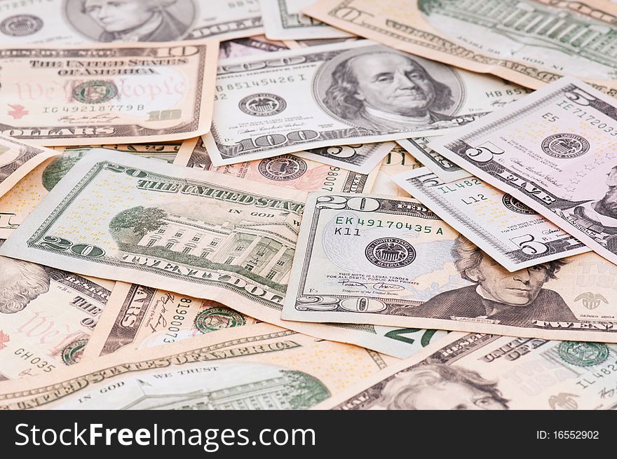 Money background of $5-$100 banknotes