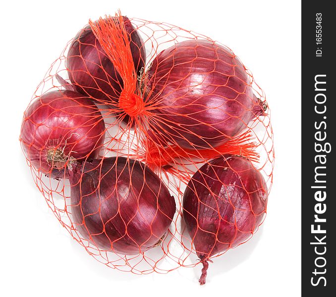 Red onion in packing from red net on white background