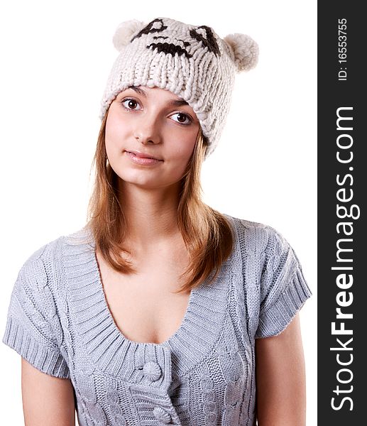 Portrait of the young girl in hat on white background