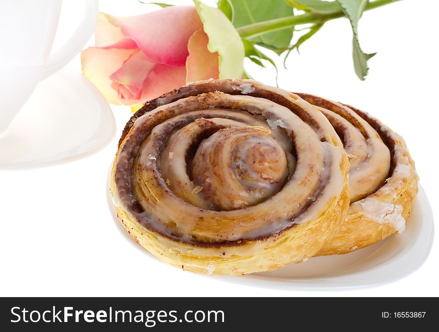 Cake with cinnamon, tea and rose