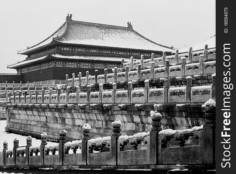 There is the main palace in Forbidden City under snow.