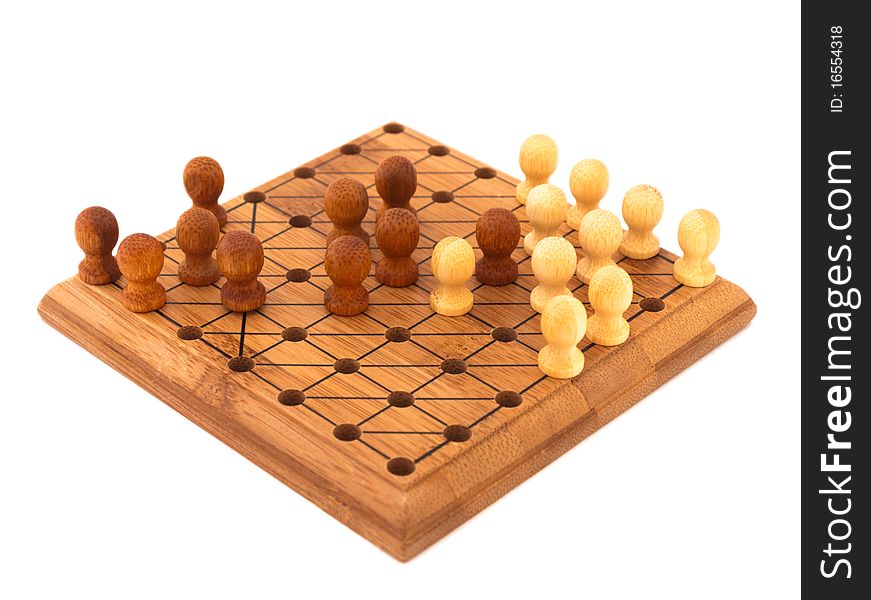 Wooden chinese checkers on a white background, last step to win