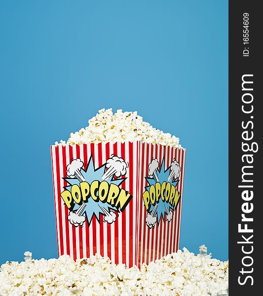 Basket of Popcorn on blue background