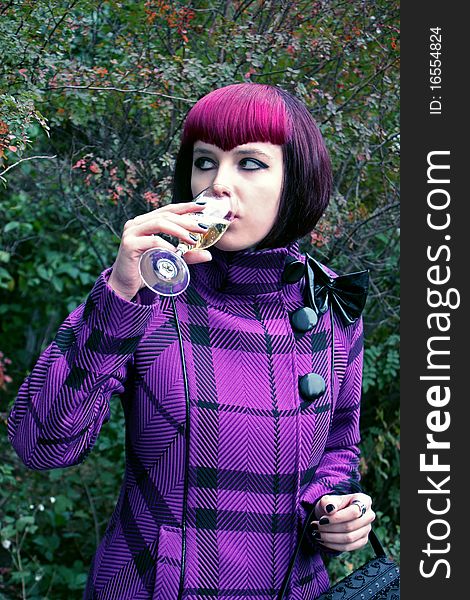 Portrait of а girl with a glass of champagne