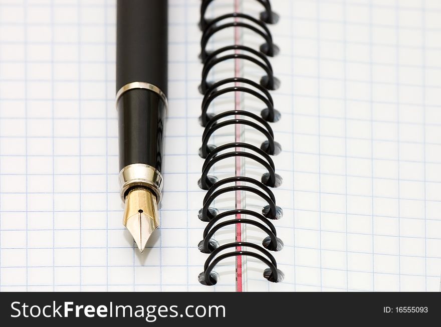 Fountain Pen and blank spiral bound notepad