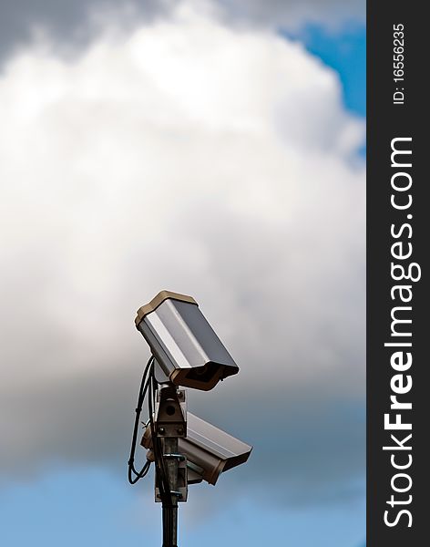 Security camera with clouds and sky. Security camera with clouds and sky