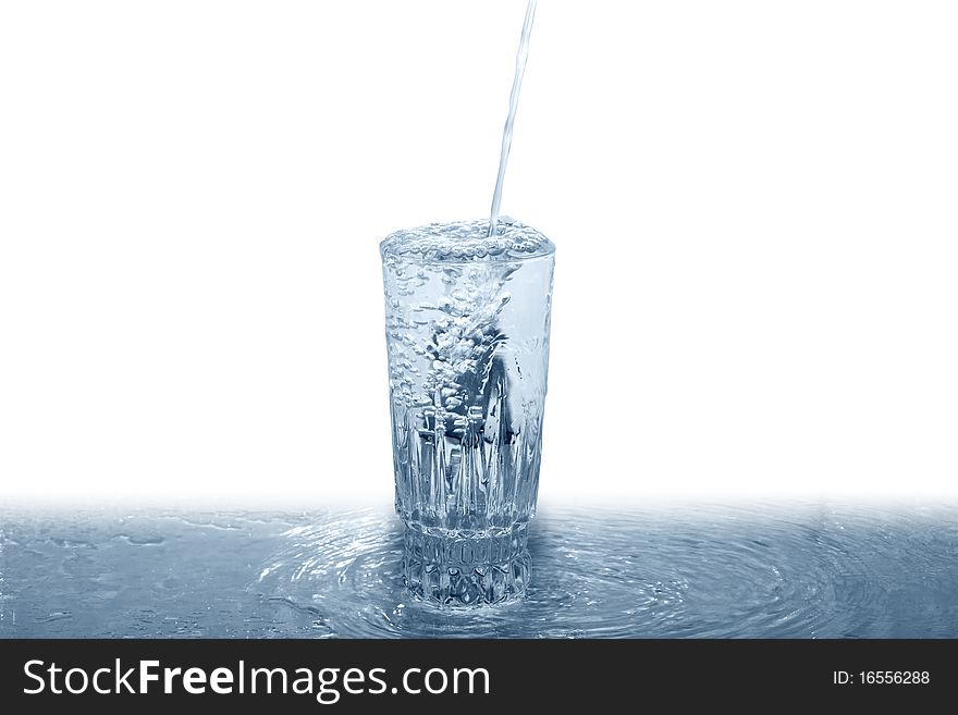 Fresh water pouring into glass. Isolated on white with clipping path. Fresh water pouring into glass. Isolated on white with clipping path