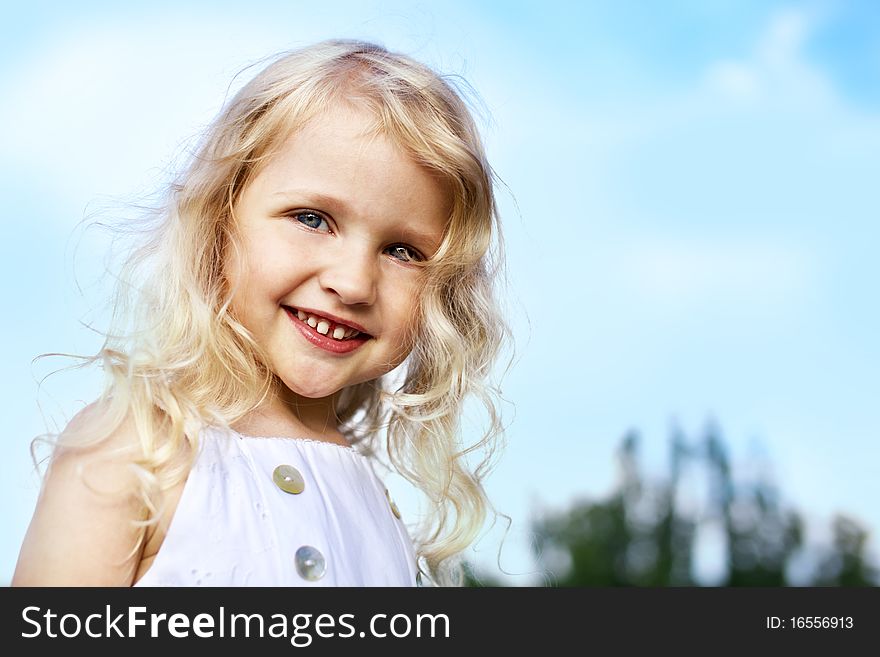 Portrait of laughing little girl outdoor