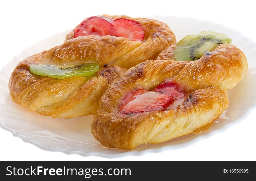 Close-up puff pastry with kiwi and strawberry, isolated on white