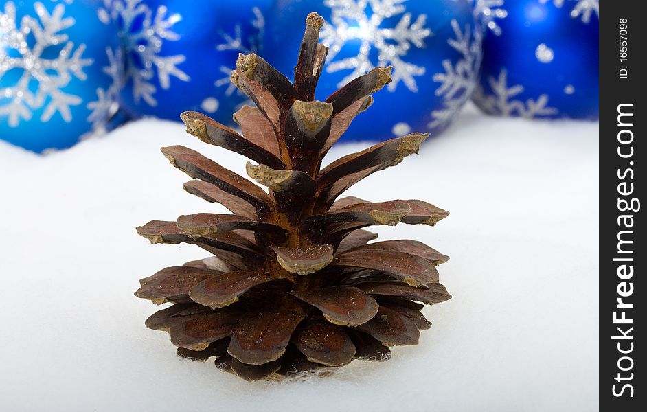 Close-up pine cone and christmas decorations, isolated on white