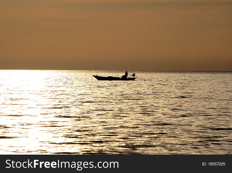 Fisherman sailing in the sea in the evening. Fisherman sailing in the sea in the evening