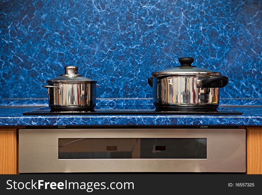 Two metal pans on a stove