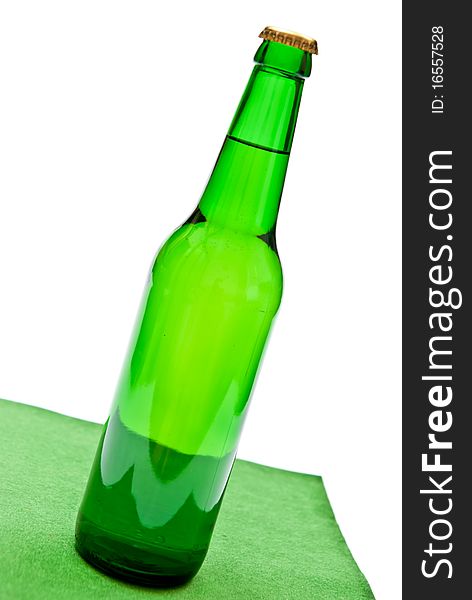 Green beer bottle on white background.