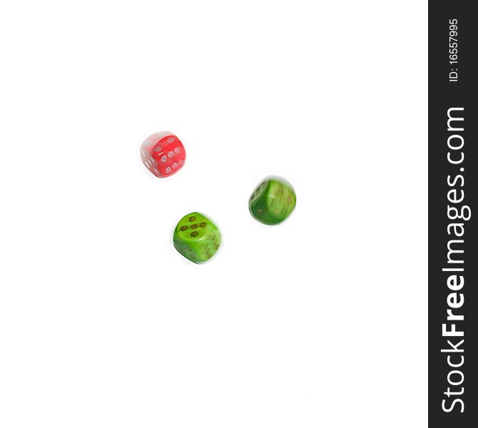 Isolated red and green rolling dice on white background