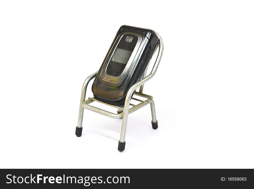 Old Mobile Phone On Small Chair