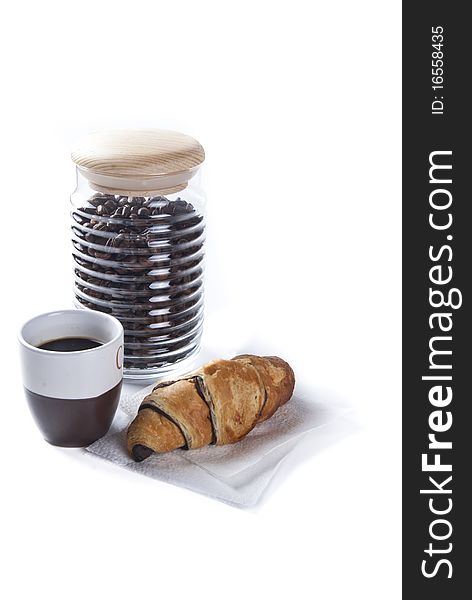 Coffee cup and croissant against white background. Coffee cup and croissant against white background