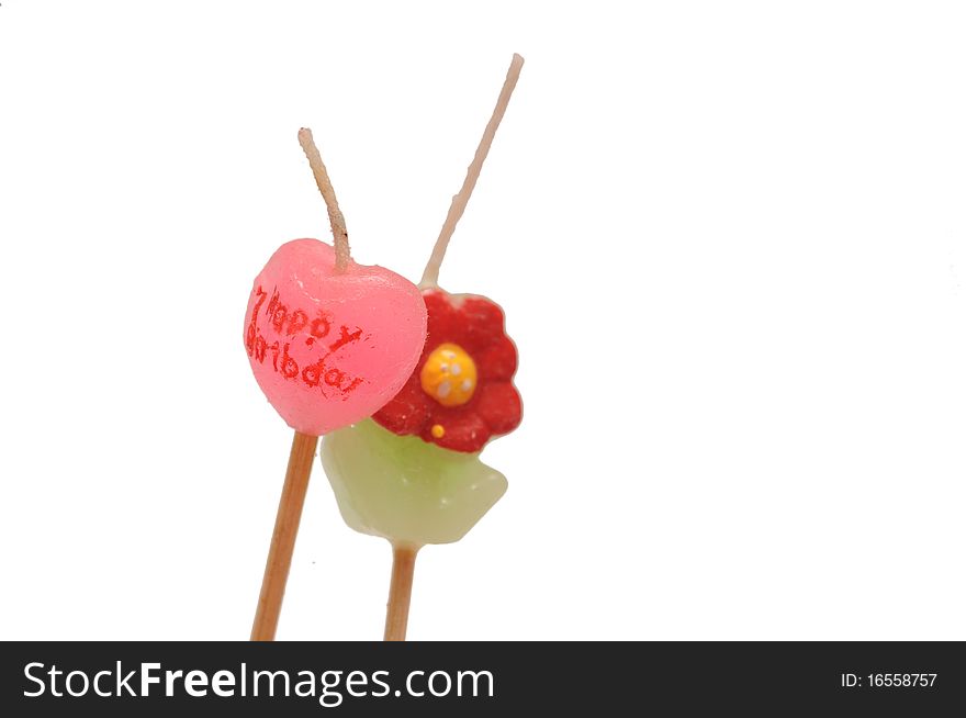 A cute and colorful photography of birthday candles heart shaped flower