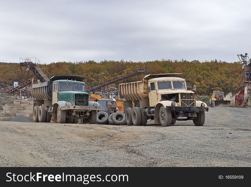 Two old truck in the quarry for the production of gravel in the Crimea