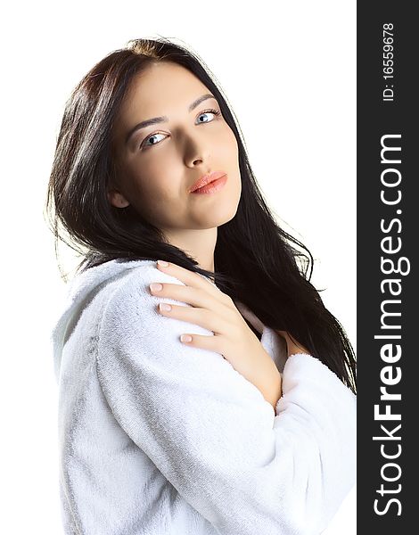 Beautiful woman in bathrobe over white background