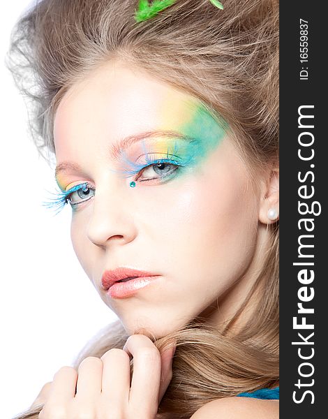 Beautiful woman with color makeup over white background. Beautiful woman with color makeup over white background