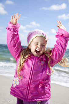 Cute Young Girl Having Fun On The Beach Stock Images