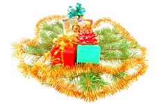 Christmas Gifts On Fur-tree Branches Royalty Free Stock Photo