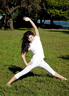 Brunet Yoga Girl On Green Grass In Park. Royalty Free Stock Image Brunet Yoga Girl On Green Grass In Park. Royalty Free Stock Image