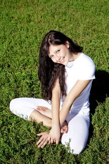 Brunet Yoga Girl On Green Grass In Park. Stock Images Brunet Yoga Girl On Green Grass In Park. Stock Images