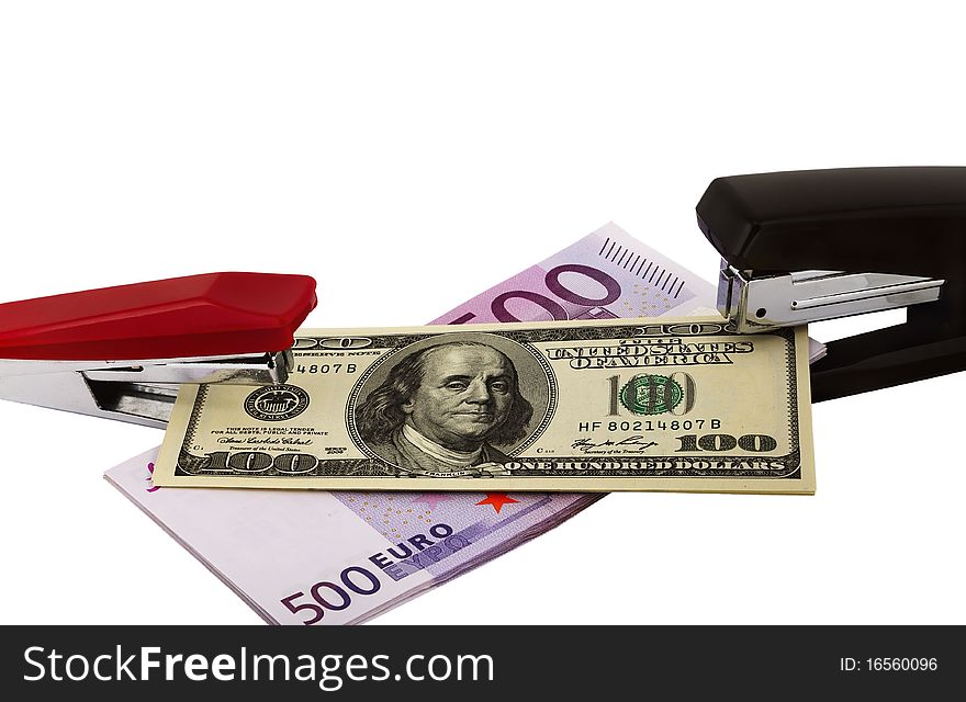 Banknotes of various currencies in an environment of staplers of the different sizes and colors. Symbolizes interrelation of various world currencies. The file includes a clipping path so it is easy to work with. Banknotes of various currencies in an environment of staplers of the different sizes and colors. Symbolizes interrelation of various world currencies. The file includes a clipping path so it is easy to work with.