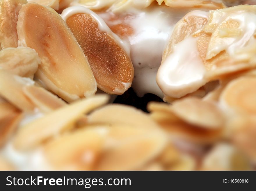 Closeup sliced almonds topping of donuts