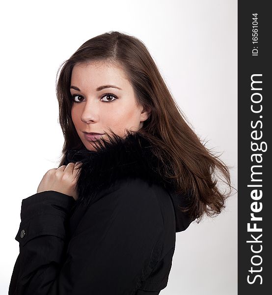Beautiful women in black coat with white background