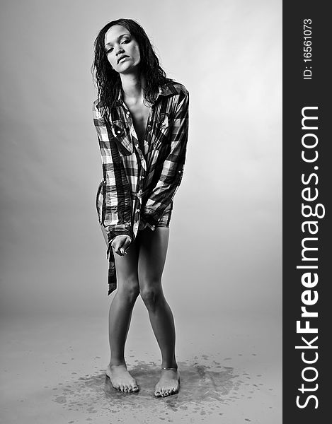 Wet fashion model drips all over the studio floor. Wet fashion model drips all over the studio floor