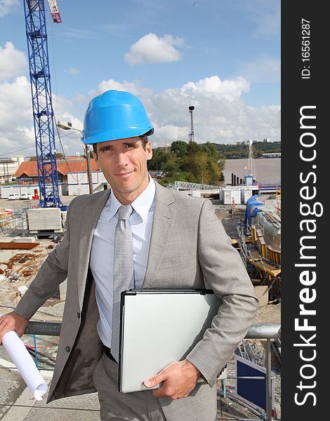 Businessman controlling site under construction. Businessman controlling site under construction
