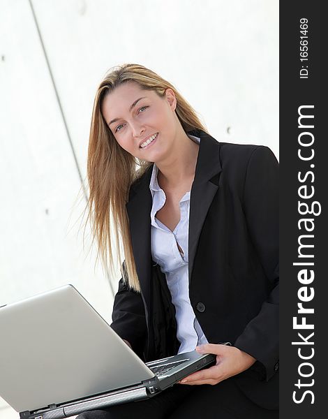 Closeup of smiling businesswoman with laptop computer. Closeup of smiling businesswoman with laptop computer