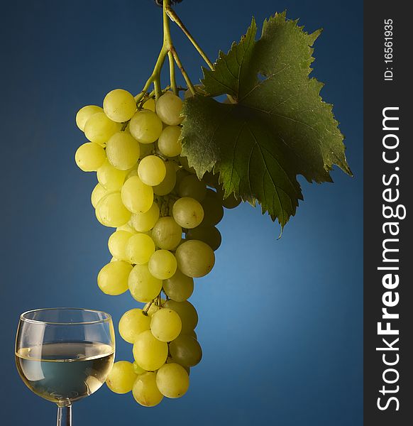 Bunch of grapes on background with  wine