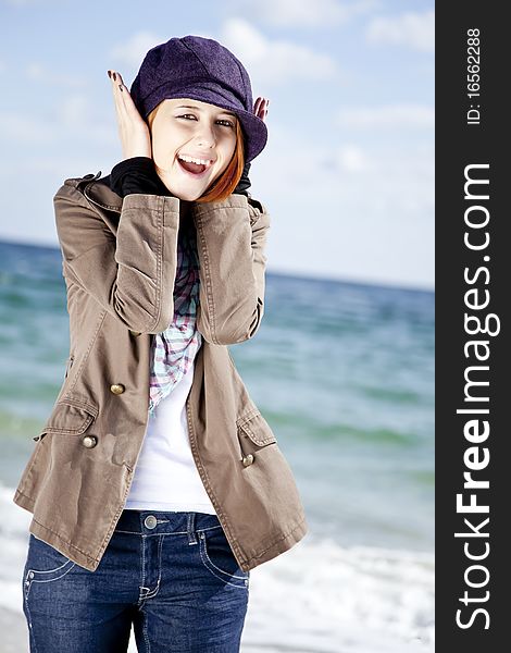 Fashion young women at the beach in sunny day. Outdoor photo.