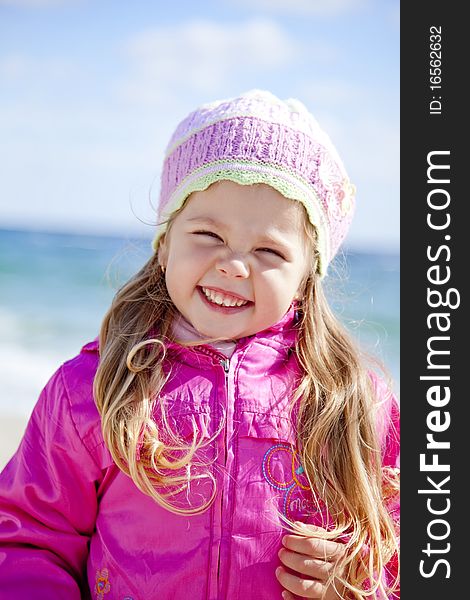 Portrait of cute young girl on the beach