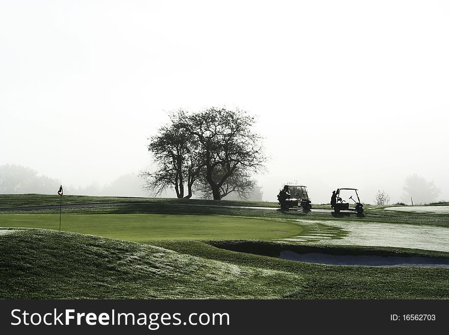 Golf Carts Waiting On Green