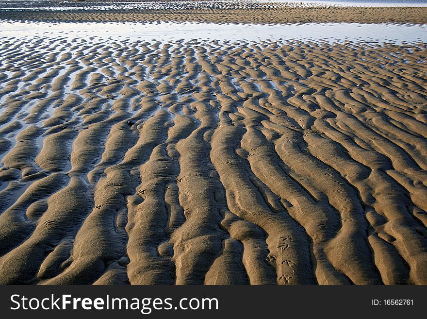 Rippled sands at wide open beach. Rippled sands at wide open beach