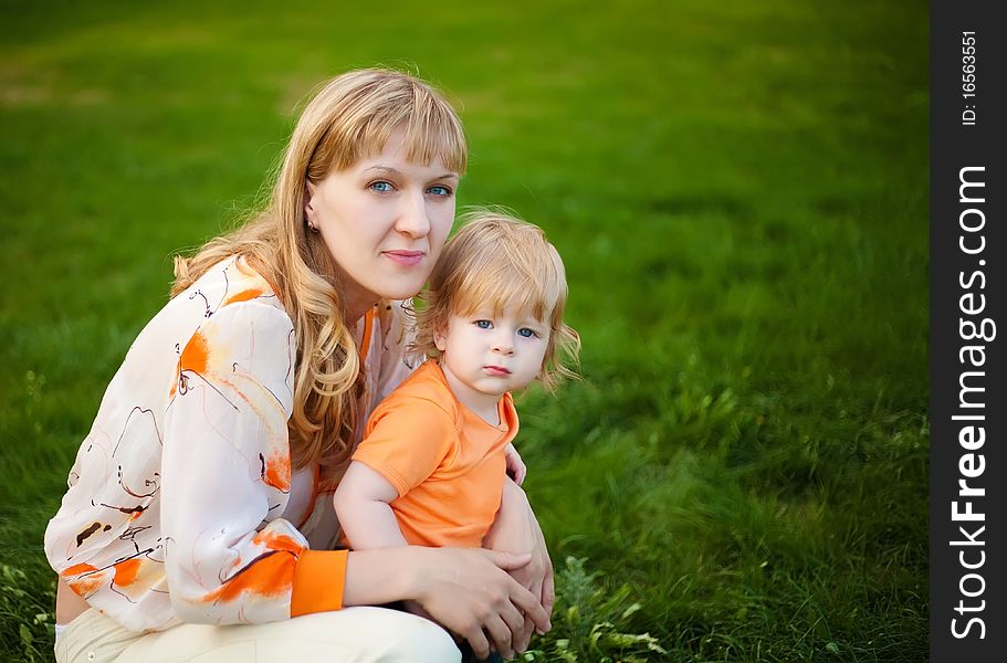 Happy mother and her little son outdoors session. Happy mother and her little son outdoors session