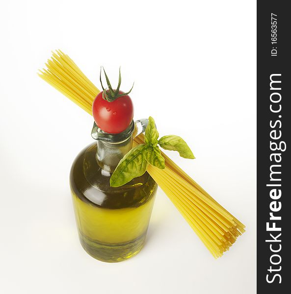 Bottle whit olive oil and spaghetti on White background