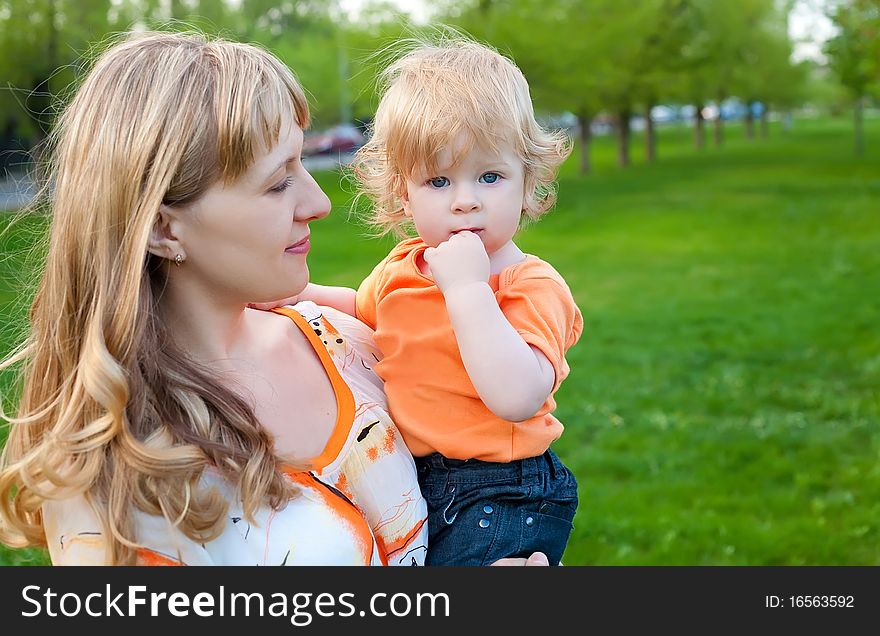 Happy mother and her little son outdoors session. Happy mother and her little son outdoors session