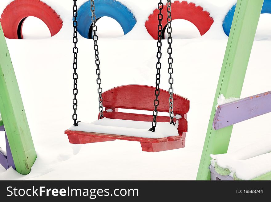 Teeter on the playground covered with snow